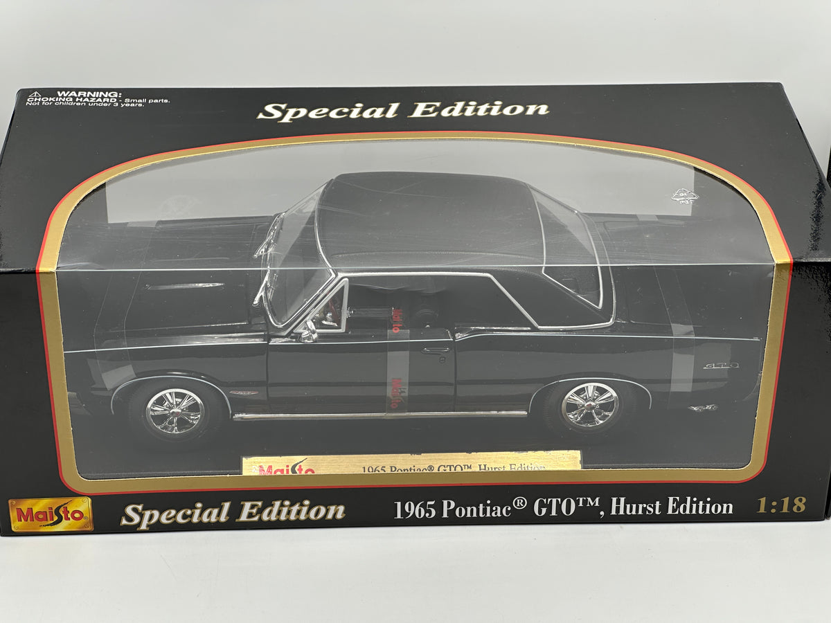 1:18 1965 Pontiac GTO Hurst Edition -- Black -- Maisto