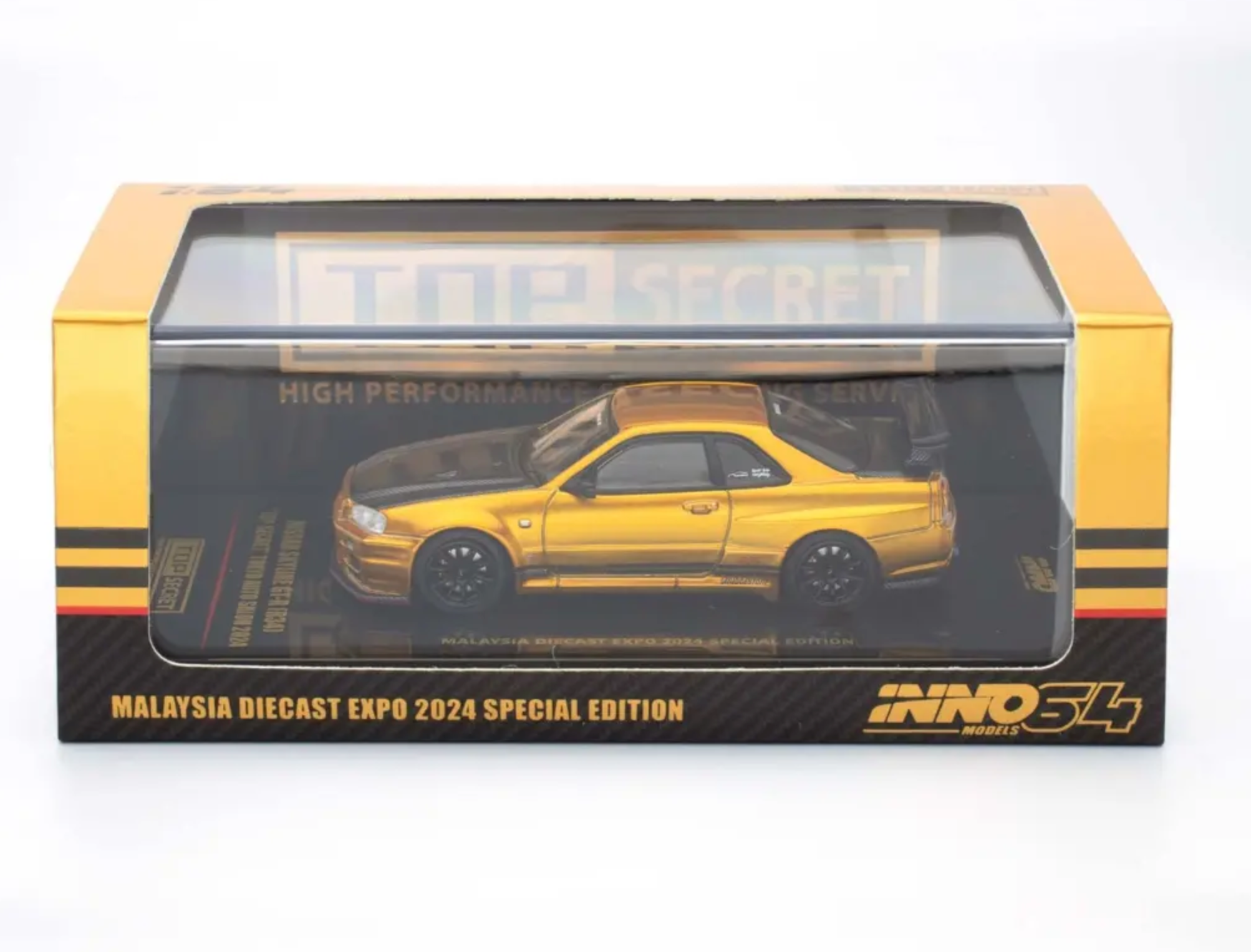 INNO64 Top Secret MDX INNO64 Nissan GT-R R34 TOP SECRET - Modellino 1:64 In Die-Cast, Edizione Speciale Salone Di Tokyo 2024, Colore Oro Nissan Skyline Gtr R34 - Foto 9
