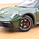 1:18 Porsche 911 (992) Dakar Coupe 2023 -- Green Metallic -- Norev